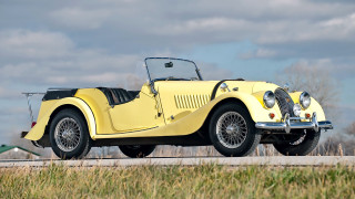 Yellow car parked road building - a yellow car free wallpaper