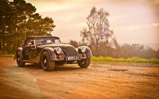 Vintage car dirt road forest - free retro wallpaper