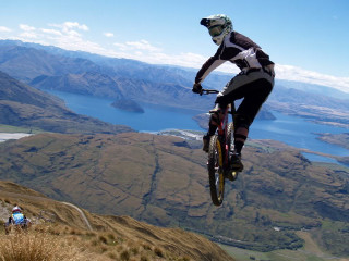 Man riding bike mountain lake 3 - a bike free wallpaper