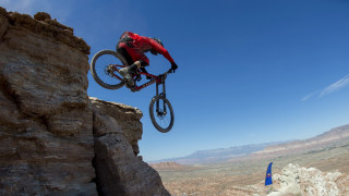 Man bike jumping cliff mountain - a bike free wallpaper
