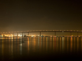 Bridge water night lights background - a bridge in the distance free wallpaper