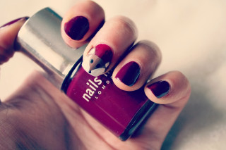 Woman holding nail polish red - a cave painting free wallpaper for desktop