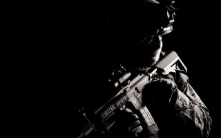 Man holding gun dark flashlight - a flashlight free wallpaper for desktop