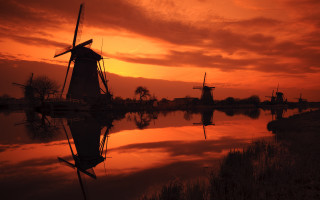 Windmill sunset water background scenery - a windmill free wallpaper