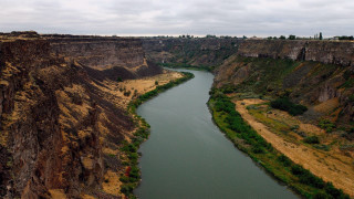 River canyon cliff cloudy sky - a few cloud above free wallpaper