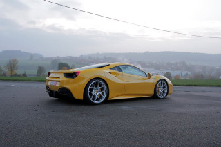 Yellow sports car parking lot 30 - a foggy sky free wallpaper for desktop