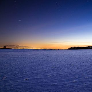 Snowy field sunset dawn sky - free winter wallpaper for tablet