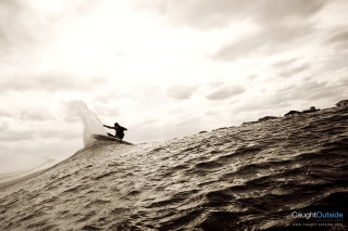 Surfboard riding wave ocean cloudy - sunbeam free wallpaper