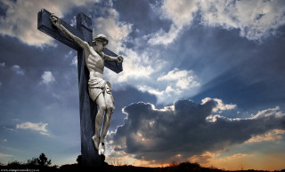 Statue man cross sky background - powerful free wallpaper