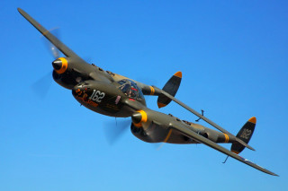 Propeller plane flying blue sky 3 - side and a propeller free wallpaper
