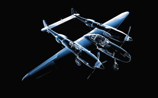 Blue model airplane flying sky - a black background behind free wallpaper