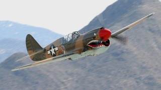 Fighter plane shark mouth flying - photorealistic imagery free wallpaper for desktop