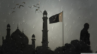 Flag clocktower rain citylights underwater - a tall building free wallpaper