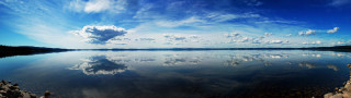 Lake clouds rocks shore scenery - a sky free wallpaper