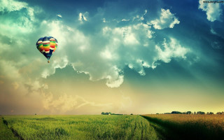Hot air balloon over lush 2 - a trail free wallpaper