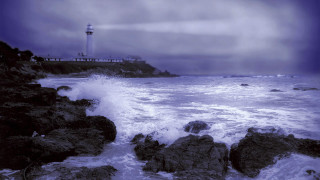 Lighthouse rocky shore wave crashing - stormy weather free wallpaper