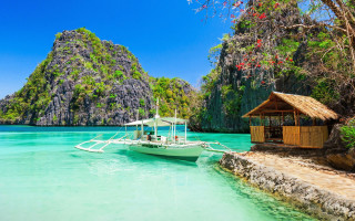 Tropical boat dock clear water - a hut free wallpaper