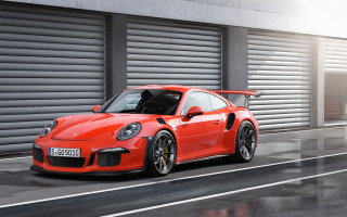 Red porsche gtr driving street - a garage door free wallpaper