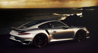 Silver sports car ocean dark - a dark sky in the background free wallpaper for desktop