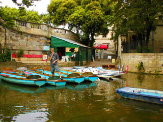 Man standing boats water building - austin english free wallpaper