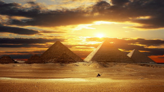 Pyramids desert sunset person walking 2 - the desert free wallpaper