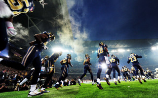 Football players night field lights - atmosphere free wallpaper