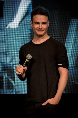 Man holding microphone smiling camera - renaissance free wallpaper for mobile