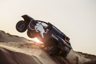 Truck jumping sand dune desert - a truck free wallpaper for desktop
