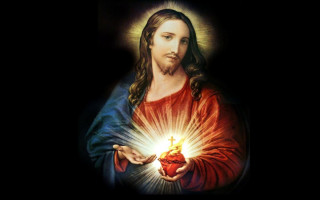 Jesus holding heart glowing light - the dark background free wallpaper for desktop