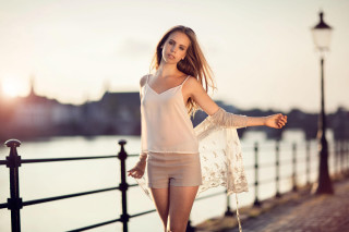 Woman shorts white top fence - a lamp post free wallpaper