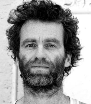 Bearded man white shirt smiling 2 - free portrait wallpaper for tablet