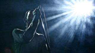 Man holding microphone sky light - dan smith free wallpaper