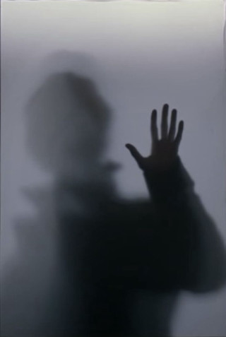 Person hand shadow wall behind - a wall behind them free wallpaper