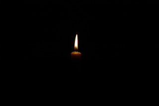Candle lit dark black background 2 - free light wallpaper