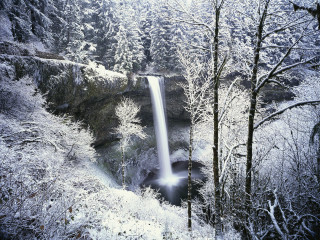 Waterfall snowy forest light beam - photography free wallpaper