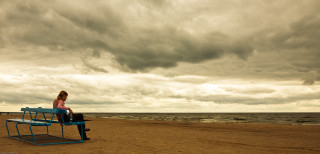 Woman bench beach cloudy sky - a bench free wallpaper for desktop