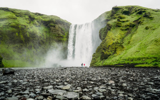 Couple waterfall Iceland man woman - evaline ness free wallpaper