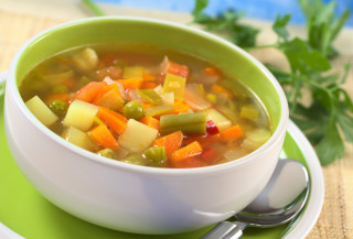 Bowl of soup with carrots - a spoon free wallpaper