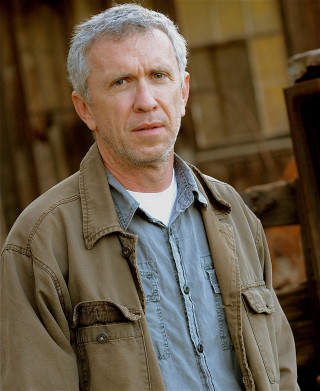 Man gray hair blue shirt - a building free wallpaper for mobile