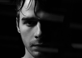 Messy hair serious look black - free portrait wallpaper