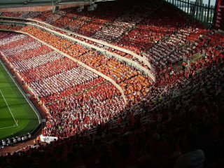 Large stadium filled people sidelines - a large stadium free wallpaper