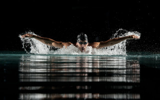 Man swimming arms spread head - eric zener free wallpaper