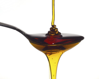 Spoon oil liquid pouring out - a liquid free wallpaper for desktop