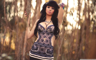 Woman corset posing woods stick - a woman in a corset free wallpaper