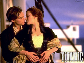 Man woman kissing boat together - free valentines wallpaper