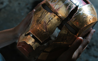 Person holding cracked helmet with - imax 70 mm footage free wallpaper