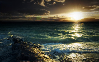 Sunset ocean waves crashing shore - a sunset over the ocean free wallpaper