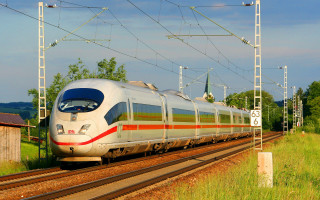 Train traveling tracks building trees - a train free wallpaper