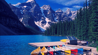 Dock canoes mountain range snow - the top of the mountains free wallpaper