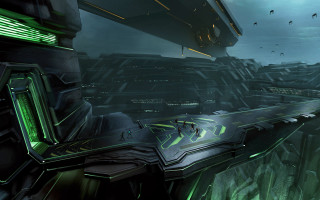 Futuristic city structure green lights - a large building in the background free wallpaper